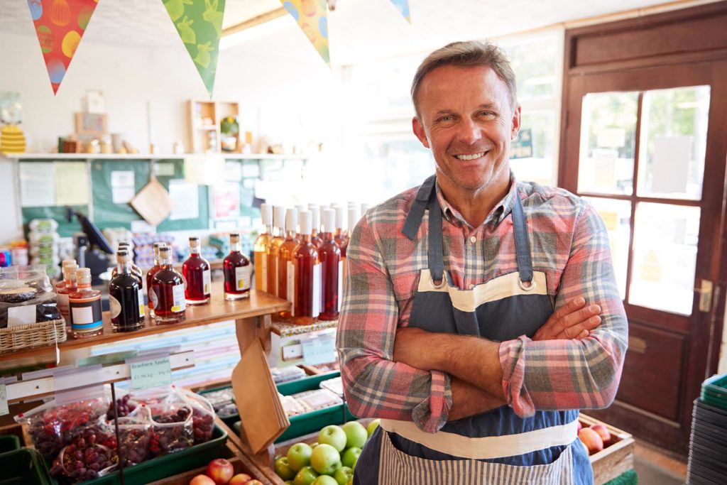 portrait-of-mature-man-running-organic-farm-shop-UTDXG92-1.jpg